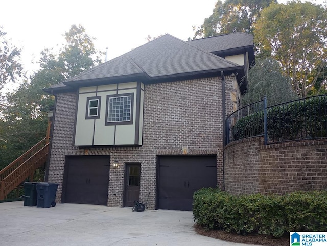 view of side of home featuring a garage