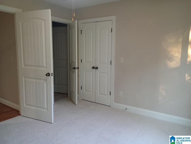 unfurnished bedroom with light carpet