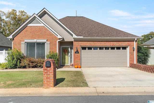 view of front of home featuring a garage and a front lawn