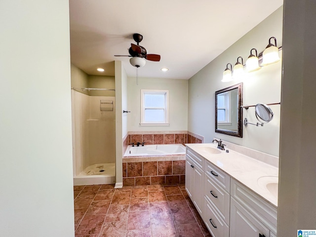 bathroom featuring vanity, ceiling fan, and independent shower and bath