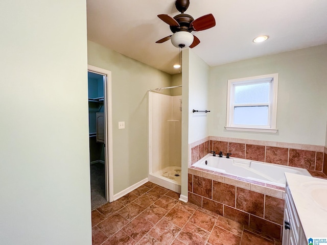 bathroom featuring vanity, plus walk in shower, and ceiling fan