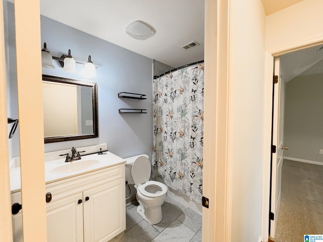 bathroom featuring vanity and toilet