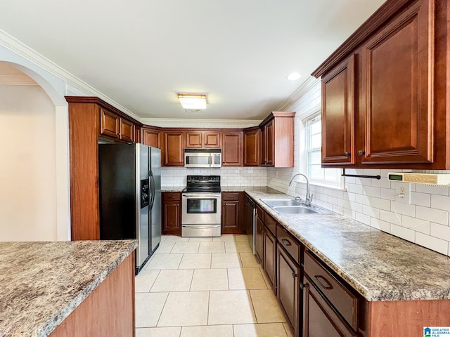 kitchen featuring stainless steel appliances, light tile patterned flooring, sink, backsplash, and crown molding