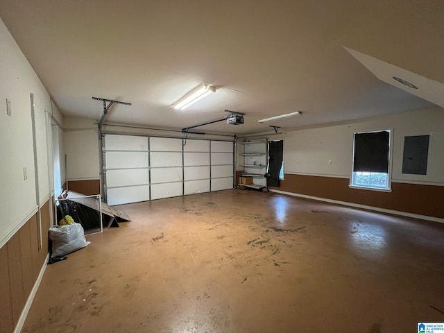 garage with electric panel, wooden walls, and a garage door opener