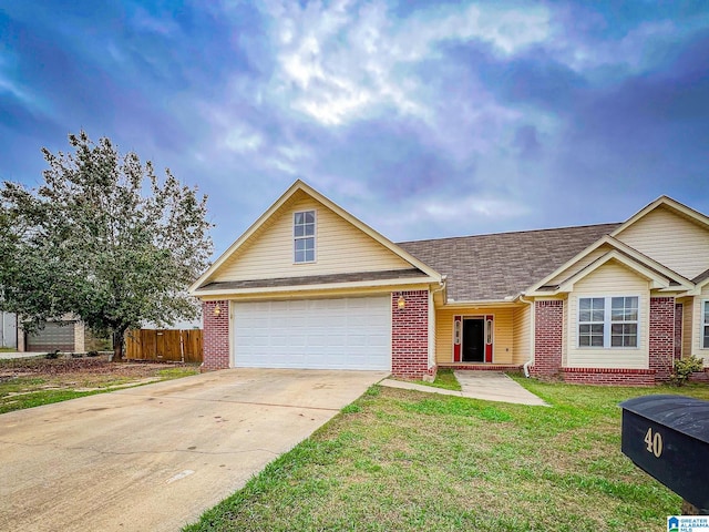 view of front of house featuring a garage and a front yard