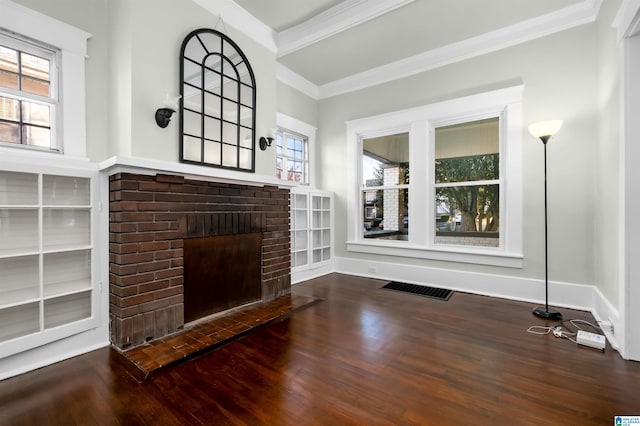 living room featuring ornamental molding, wood-type flooring, and a brick fireplace