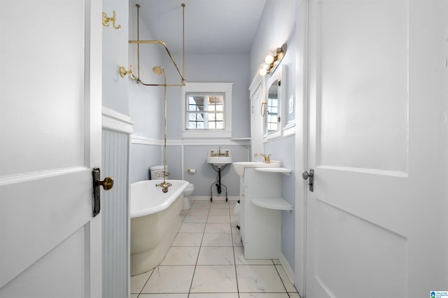 bathroom with a bathing tub and vanity