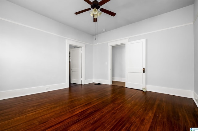 unfurnished bedroom with dark hardwood / wood-style floors, a closet, and ceiling fan