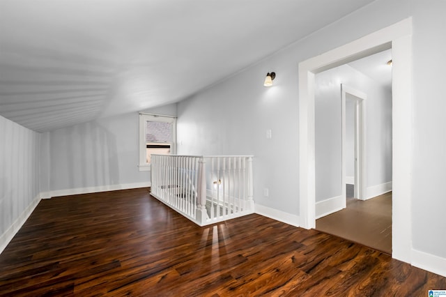 additional living space featuring dark hardwood / wood-style floors