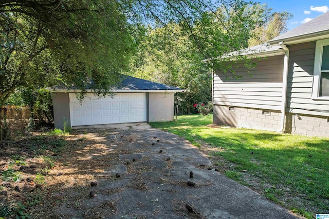 garage featuring a yard