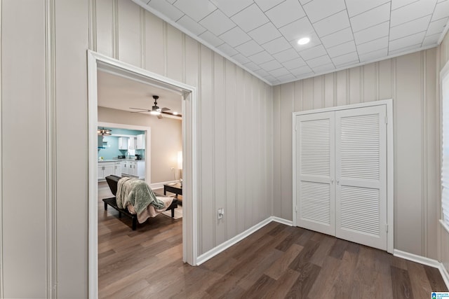 hall with dark wood-type flooring