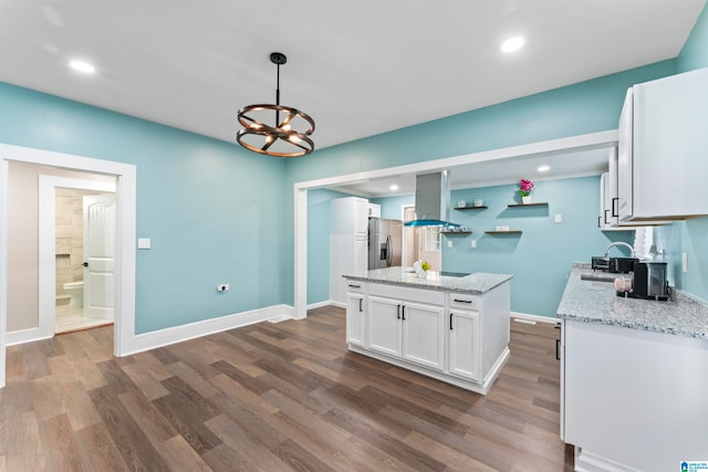 kitchen with white cabinets, island exhaust hood, dark hardwood / wood-style flooring, pendant lighting, and stainless steel refrigerator with ice dispenser