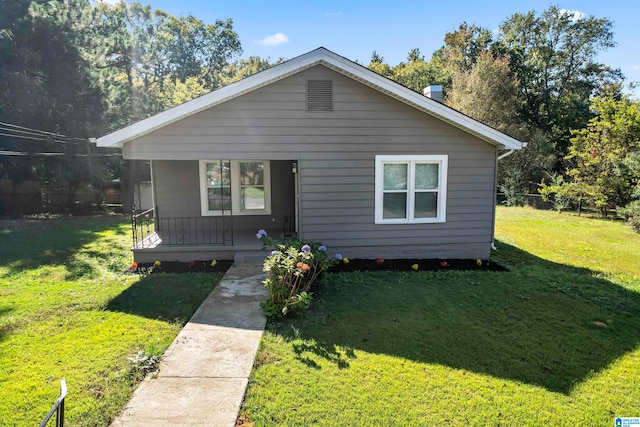 bungalow-style home featuring a front lawn