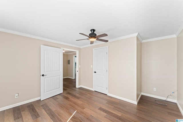 unfurnished bedroom with ceiling fan, crown molding, and hardwood / wood-style floors