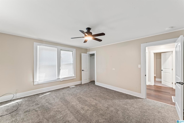 unfurnished bedroom with carpet flooring and ceiling fan