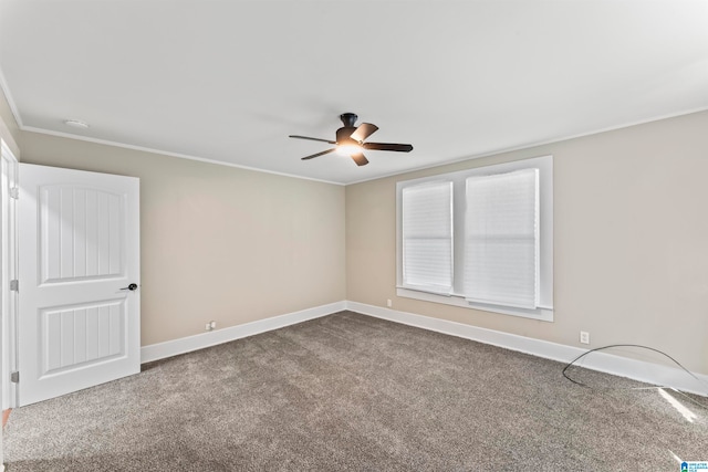 carpeted empty room featuring crown molding and ceiling fan