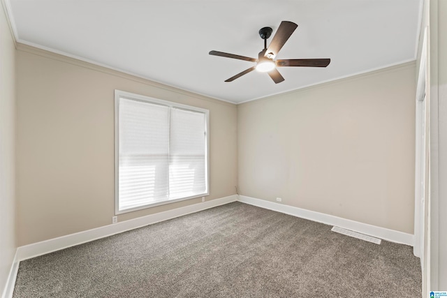 empty room with ceiling fan, carpet, and ornamental molding