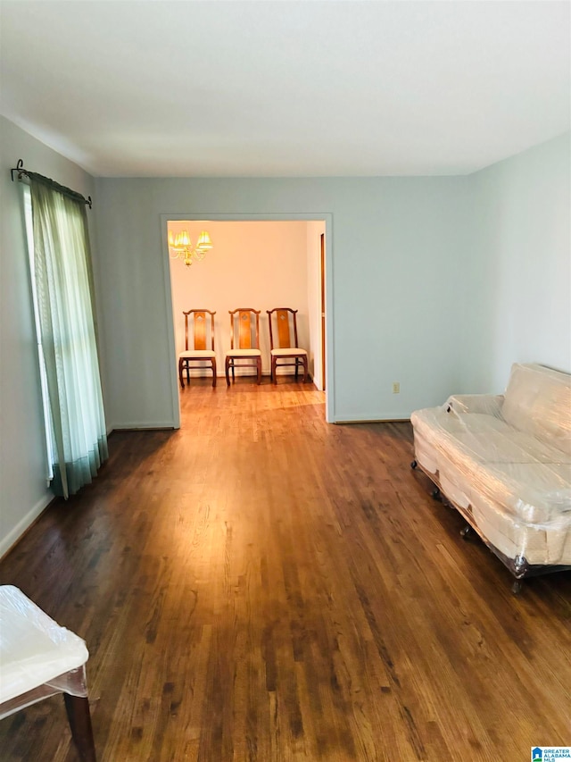 sitting room with hardwood / wood-style flooring