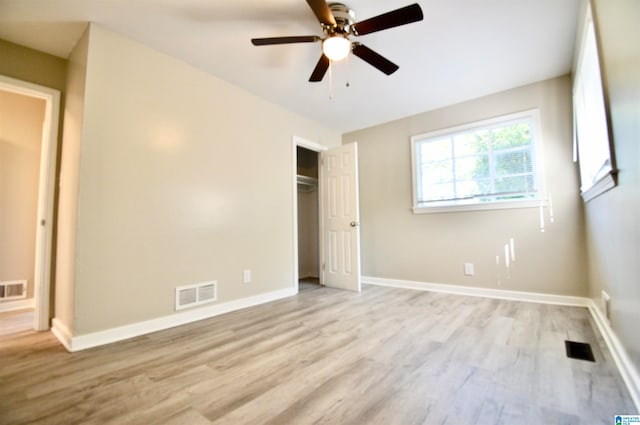 unfurnished bedroom with light hardwood / wood-style flooring and ceiling fan