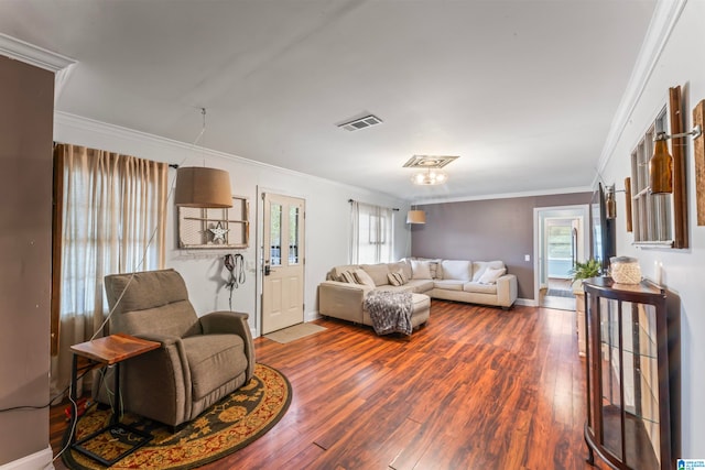 living room with ornamental molding and hardwood / wood-style floors