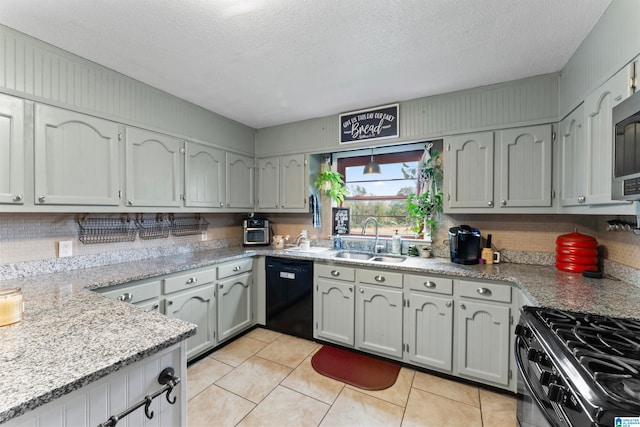 kitchen featuring dishwasher, decorative backsplash, a textured ceiling, and sink