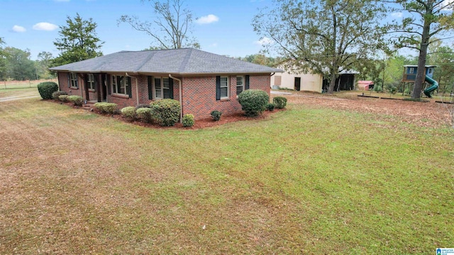 view of side of property with a lawn