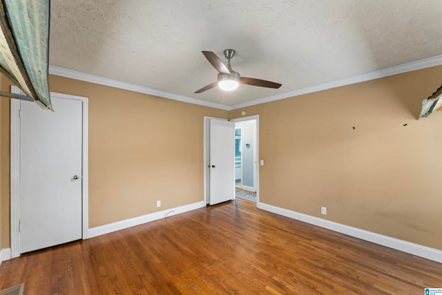 unfurnished bedroom featuring a textured ceiling, hardwood / wood-style flooring, crown molding, and ceiling fan