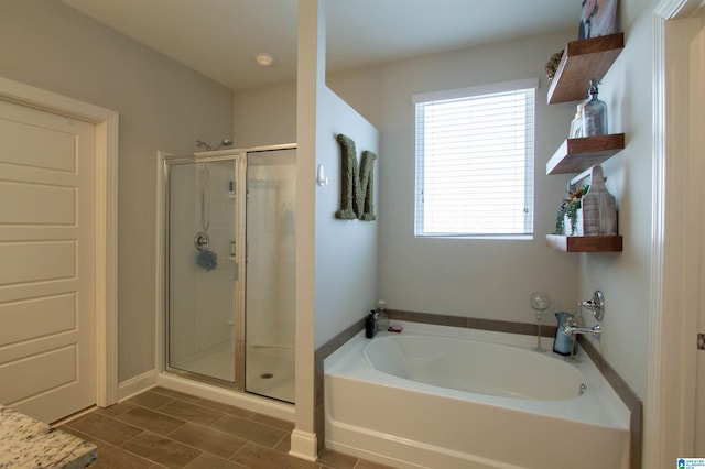 bathroom with separate shower and tub