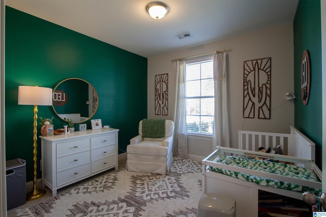 bedroom featuring a crib