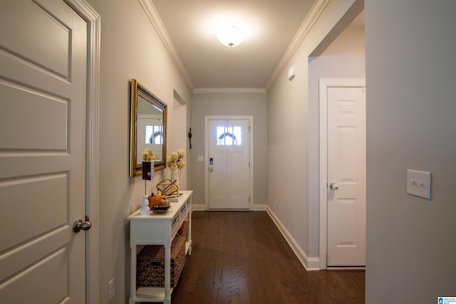 entryway with ornamental molding and dark hardwood / wood-style flooring