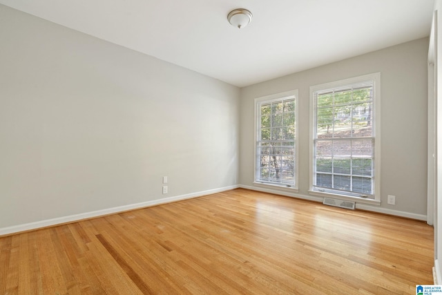 empty room with light hardwood / wood-style floors