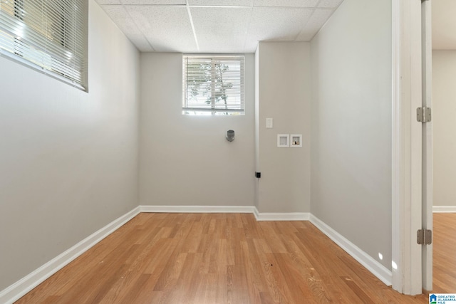 laundry area with light hardwood / wood-style flooring and hookup for a washing machine