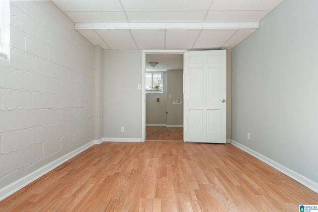 interior space featuring light hardwood / wood-style flooring and a paneled ceiling