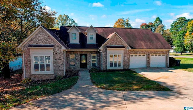 view of front of home featuring a front yard and a garage