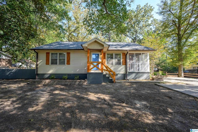 view of front of property featuring a sunroom