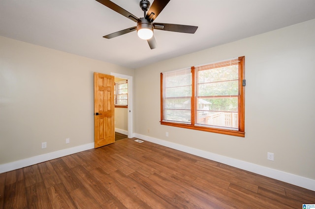 spare room with ceiling fan and hardwood / wood-style flooring