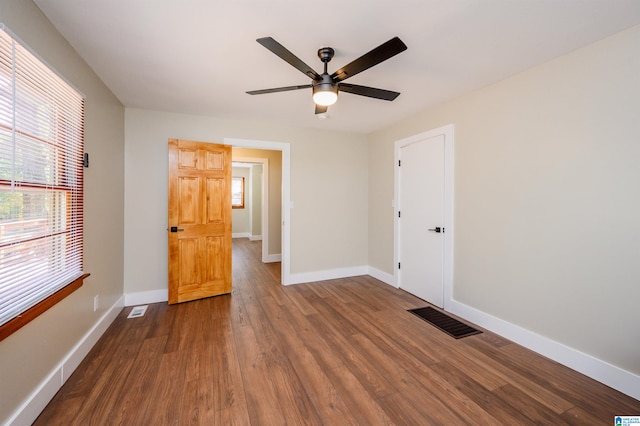 unfurnished bedroom featuring hardwood / wood-style flooring and ceiling fan