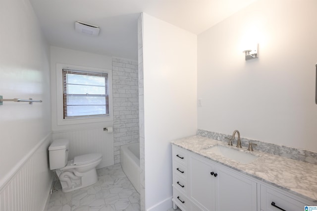 bathroom featuring vanity and toilet