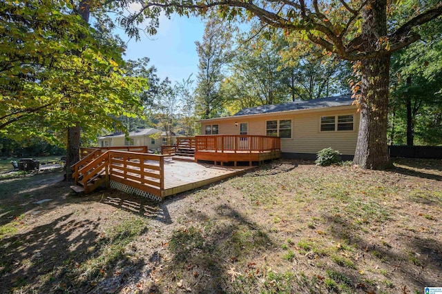 back of house featuring a deck