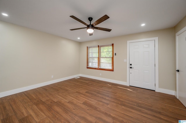 entryway featuring dark wood-type flooring and ceiling fan