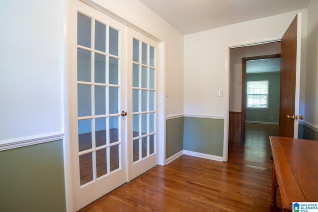 interior space featuring dark wood-type flooring and a textured ceiling