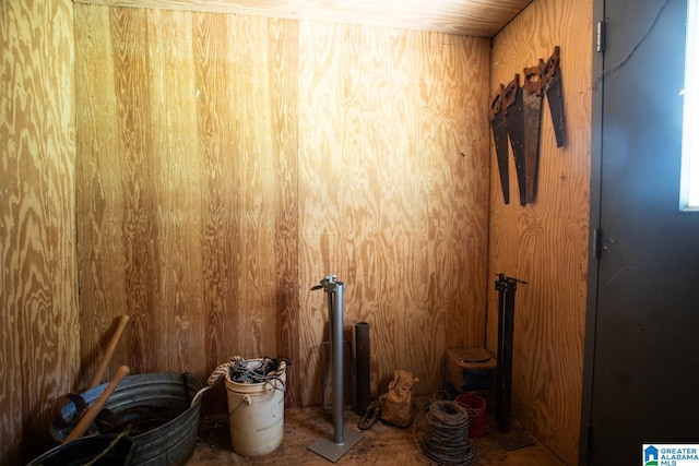 interior space featuring wooden walls