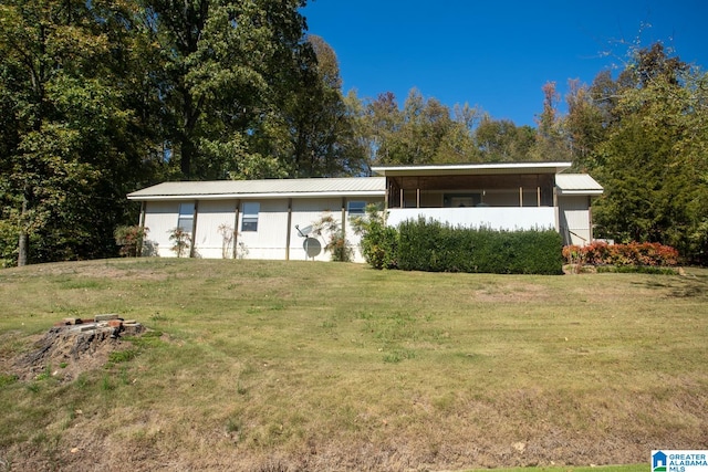 ranch-style house with a front lawn