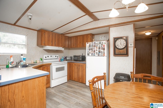 kitchen featuring lofted ceiling, light hardwood / wood-style flooring, pendant lighting, sink, and white appliances