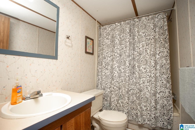 bathroom featuring vanity, toilet, and walk in shower