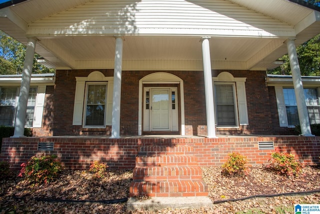 entrance to property with covered porch