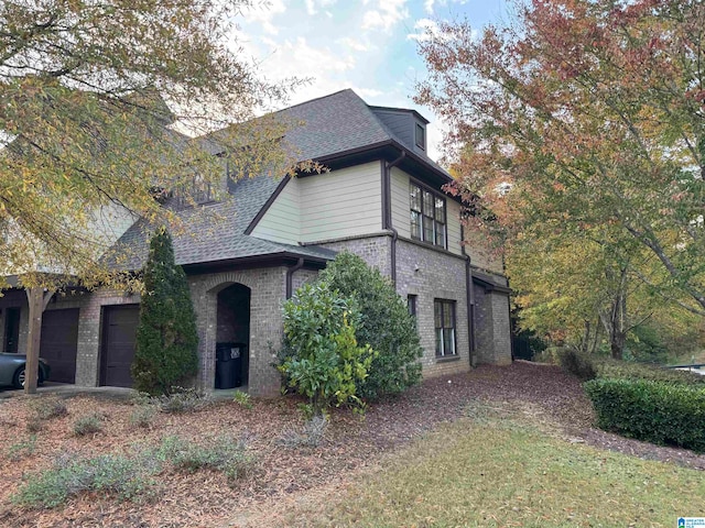 view of side of home with a garage