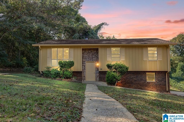 view of front of home with a lawn