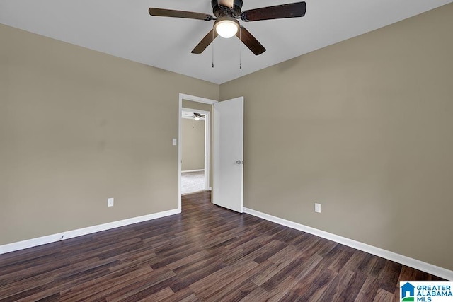 empty room featuring dark hardwood / wood-style floors and ceiling fan