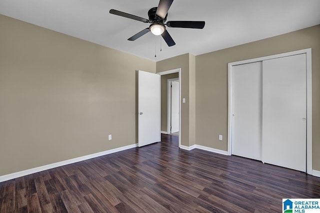 unfurnished bedroom featuring dark hardwood / wood-style floors, a closet, and ceiling fan